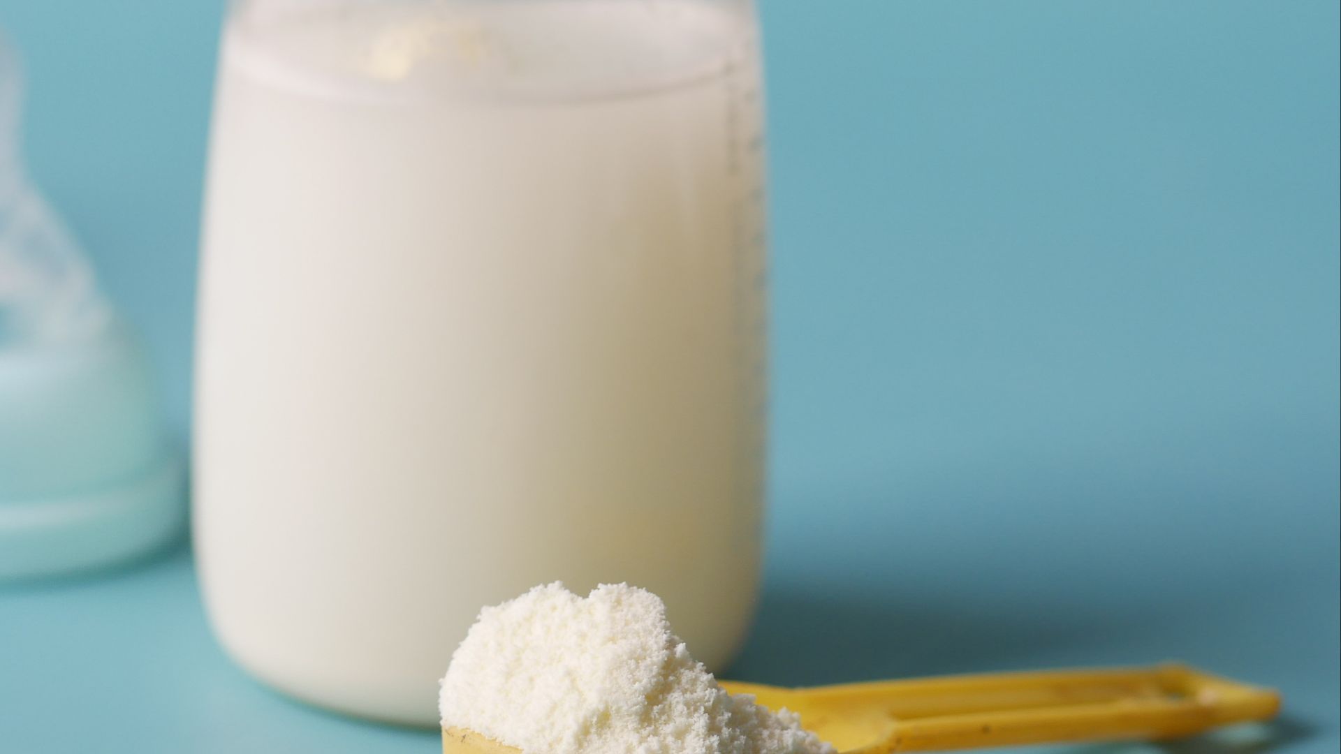 A Close-Up Shot of a Scooped Formula Milk Powder