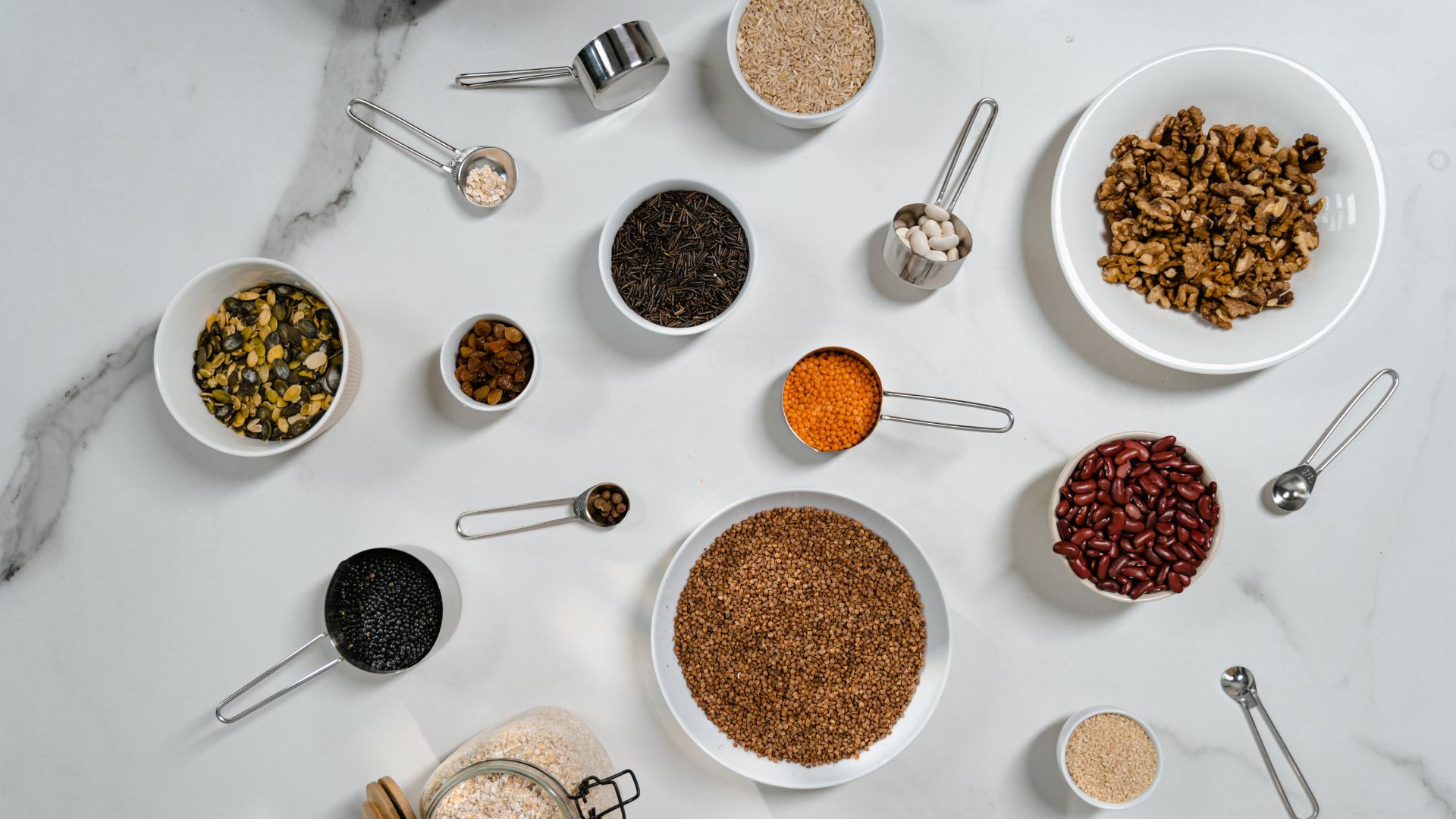 Assorted Dried Herbs and Spices Over a Marble Top Table