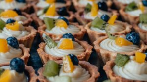 Close-up Photography of Three Kiwi Topped Tarts