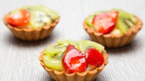 Close-up Photography of Three Kiwi Topped Tarts