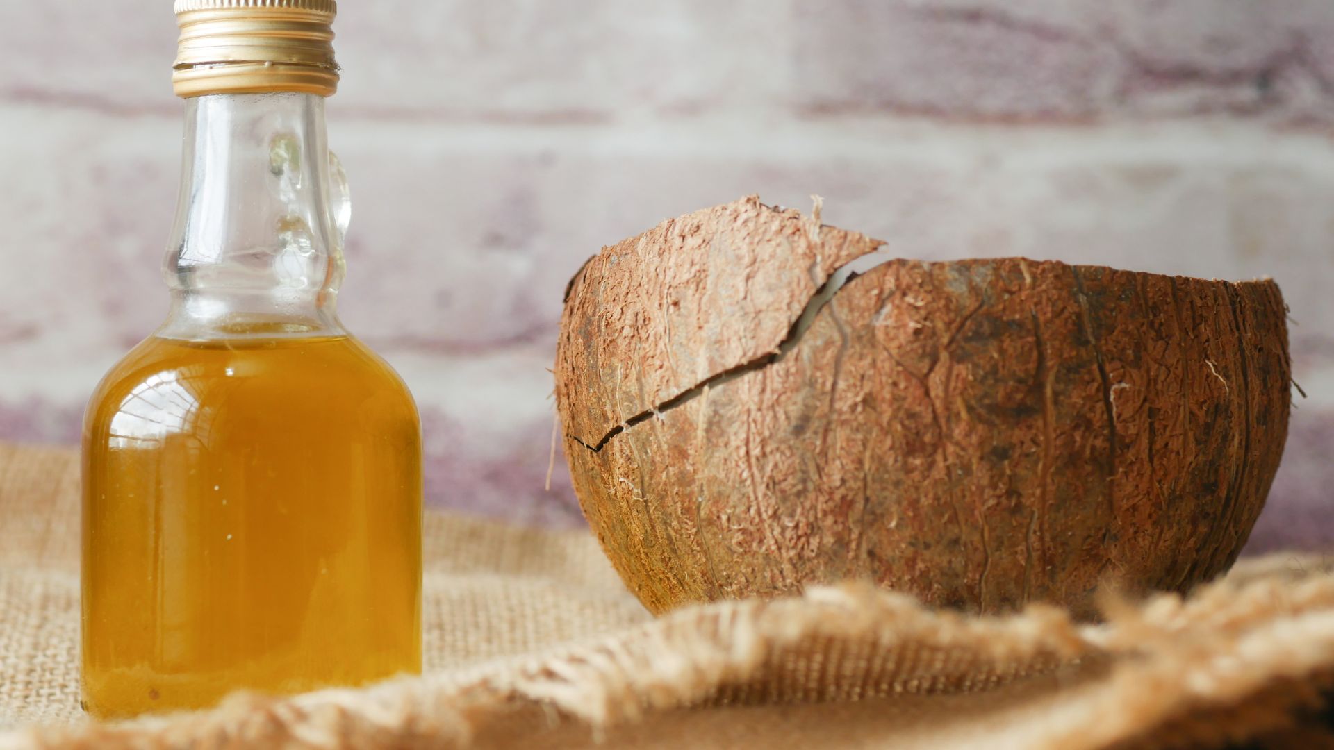 Little Bottle with Liquid and a Coconut Shell