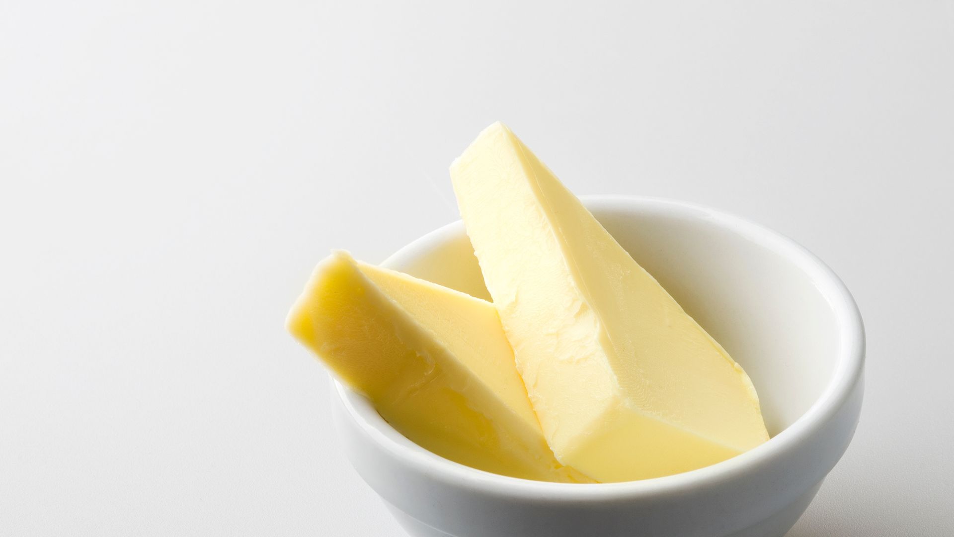 Sliced Butter in White Ceramic Bowl